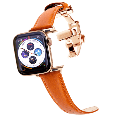 gold apple watch with whiskey brown leather band for women